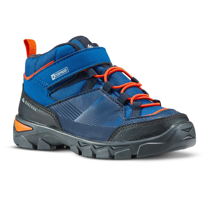 





Chaussures imperméables de randonnée -MH120 MID bleues- enfant 28 AU 34 scratch, photo 1 of 6